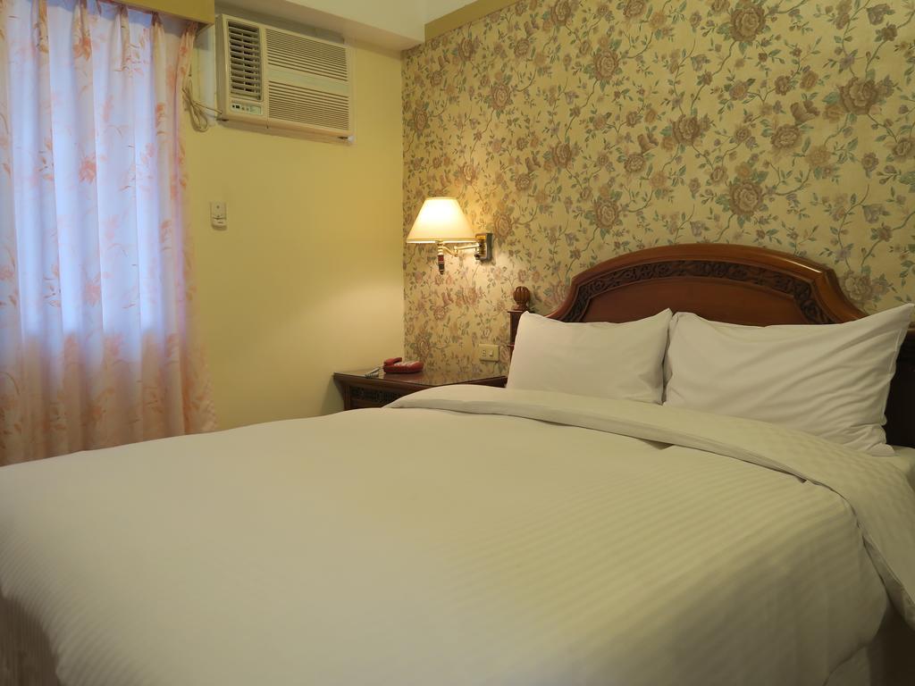 Champagne Hotel Jiaoxi Rom bilde